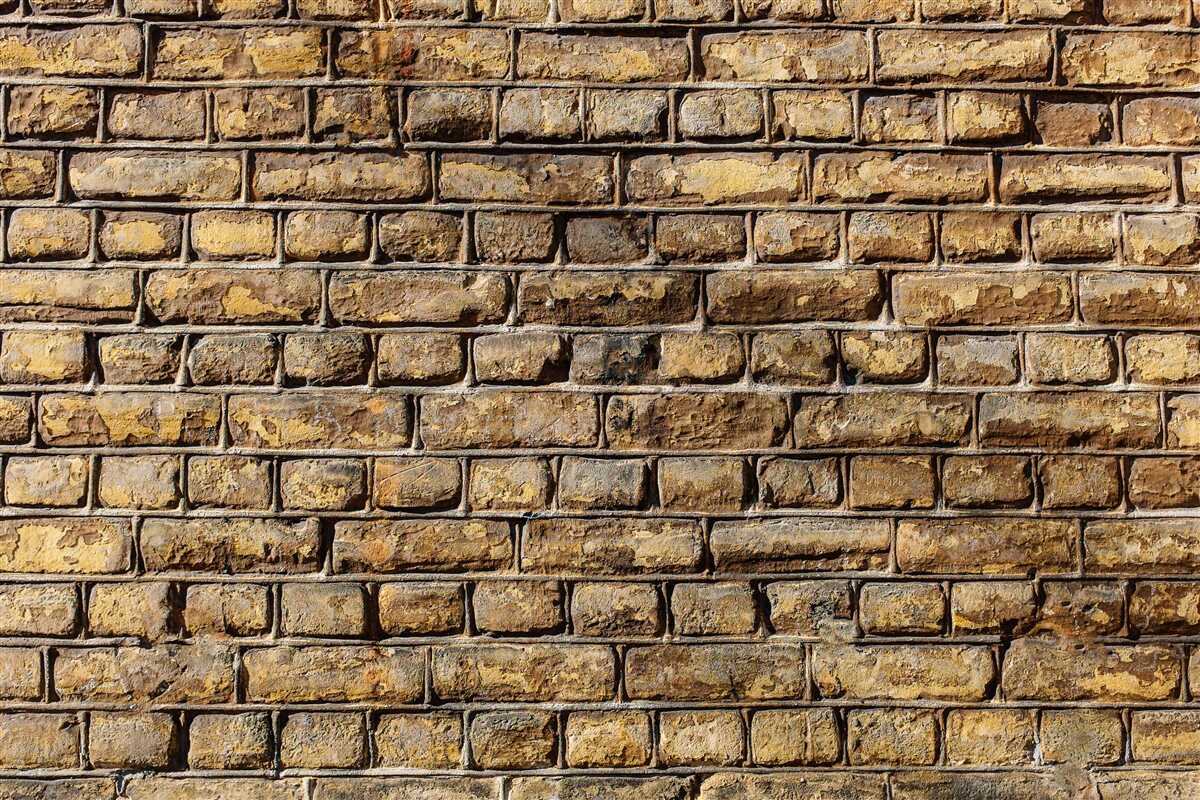 Fotobehang Onbehandelde bakstenen muur