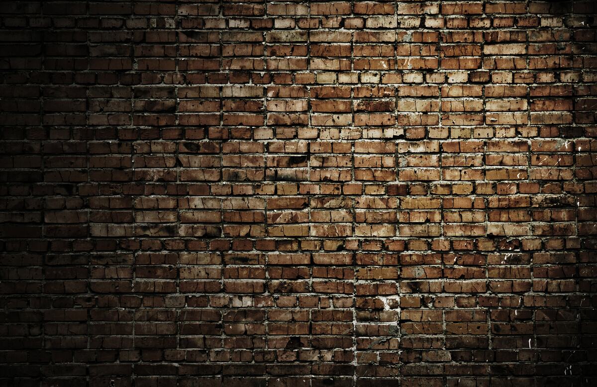 Fotobehang donkere bakstenen muur