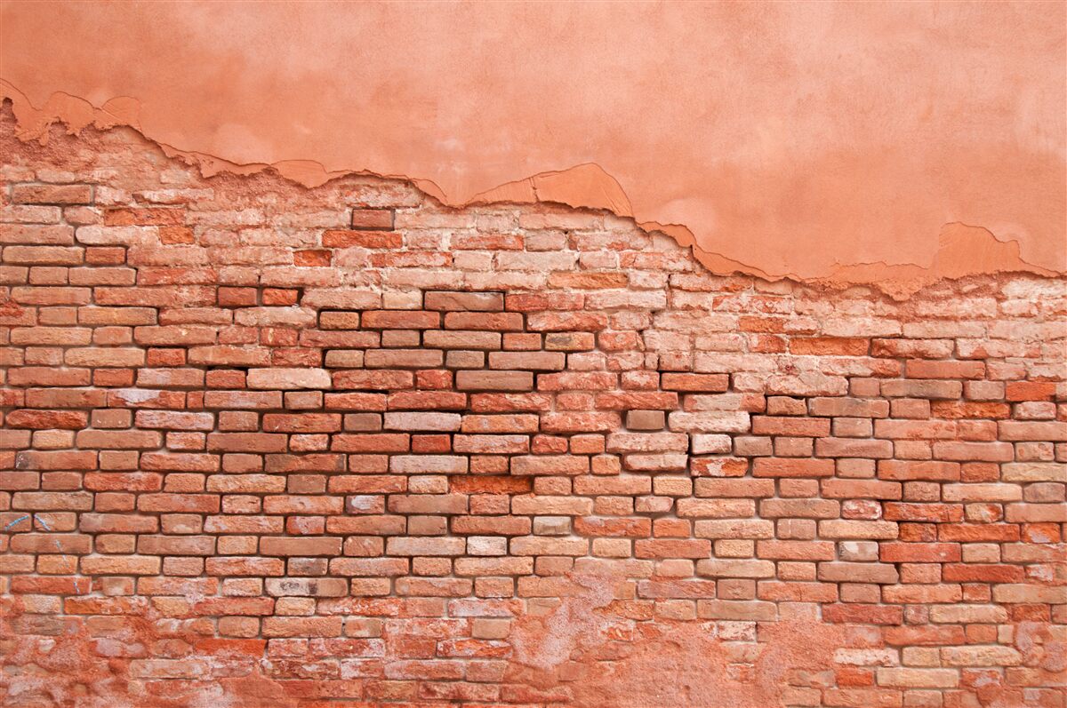 Fotobehang ingestorte bakstenen muur