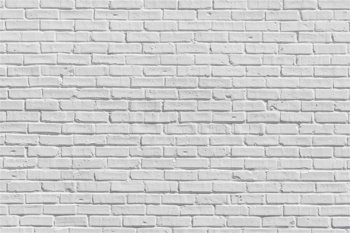 Fotobehang De bakstenen muur is wit geschilderd
