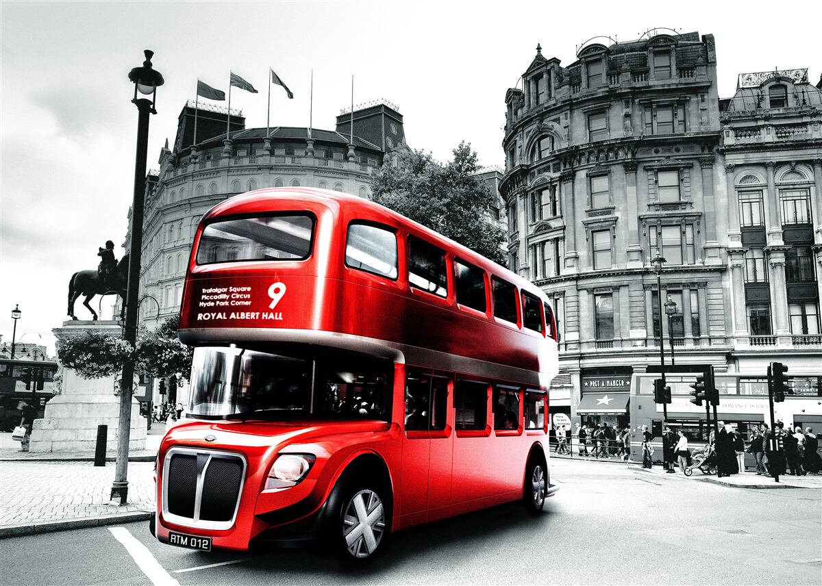 Fotobehang een bus uit londen in een stadsstraat