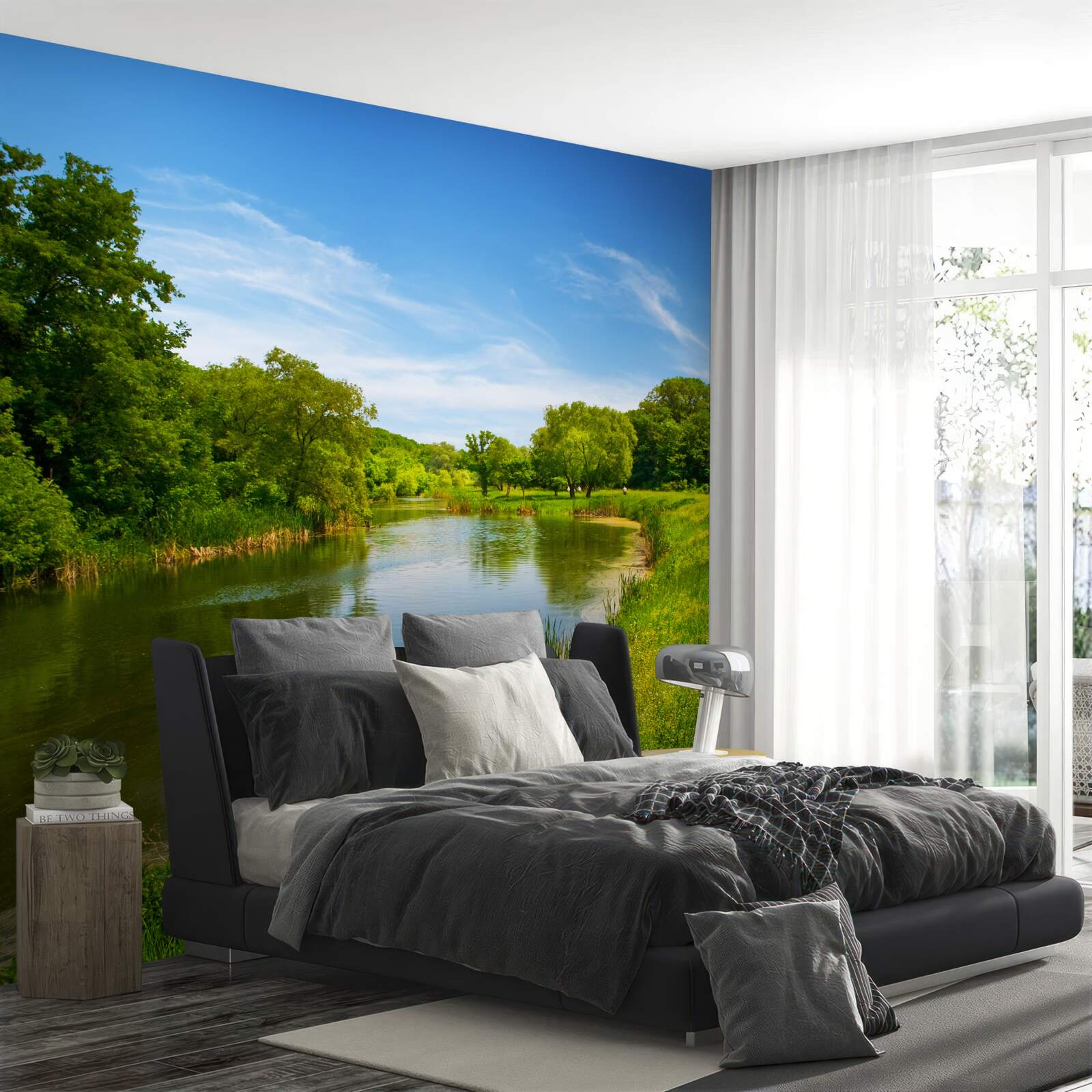 Fotobehang een groene weide waar kalm water doorheen stroomt
