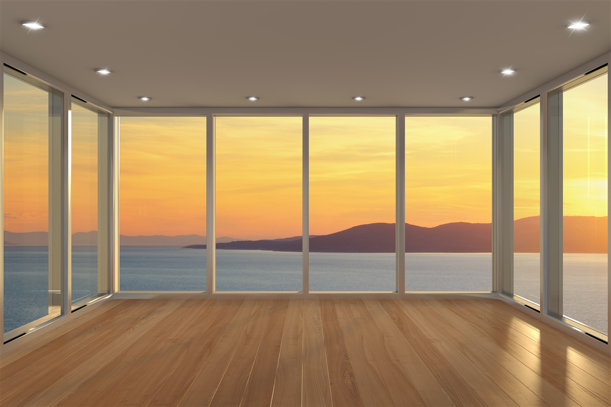 Fotobehang ongelooflijk mooi landschap van zonsondergang en zee vanuit panoramische ramen