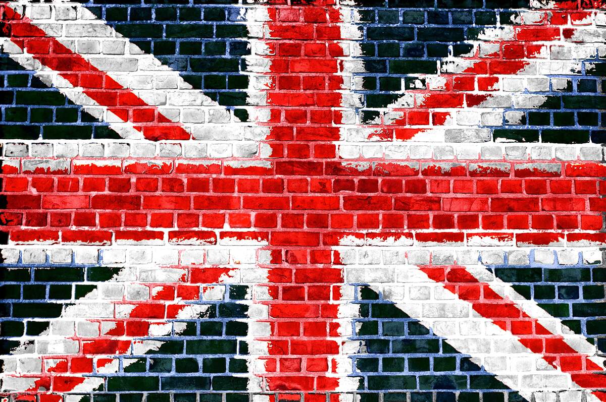 Fotobehang vlag van engeland op een bakstenen muur