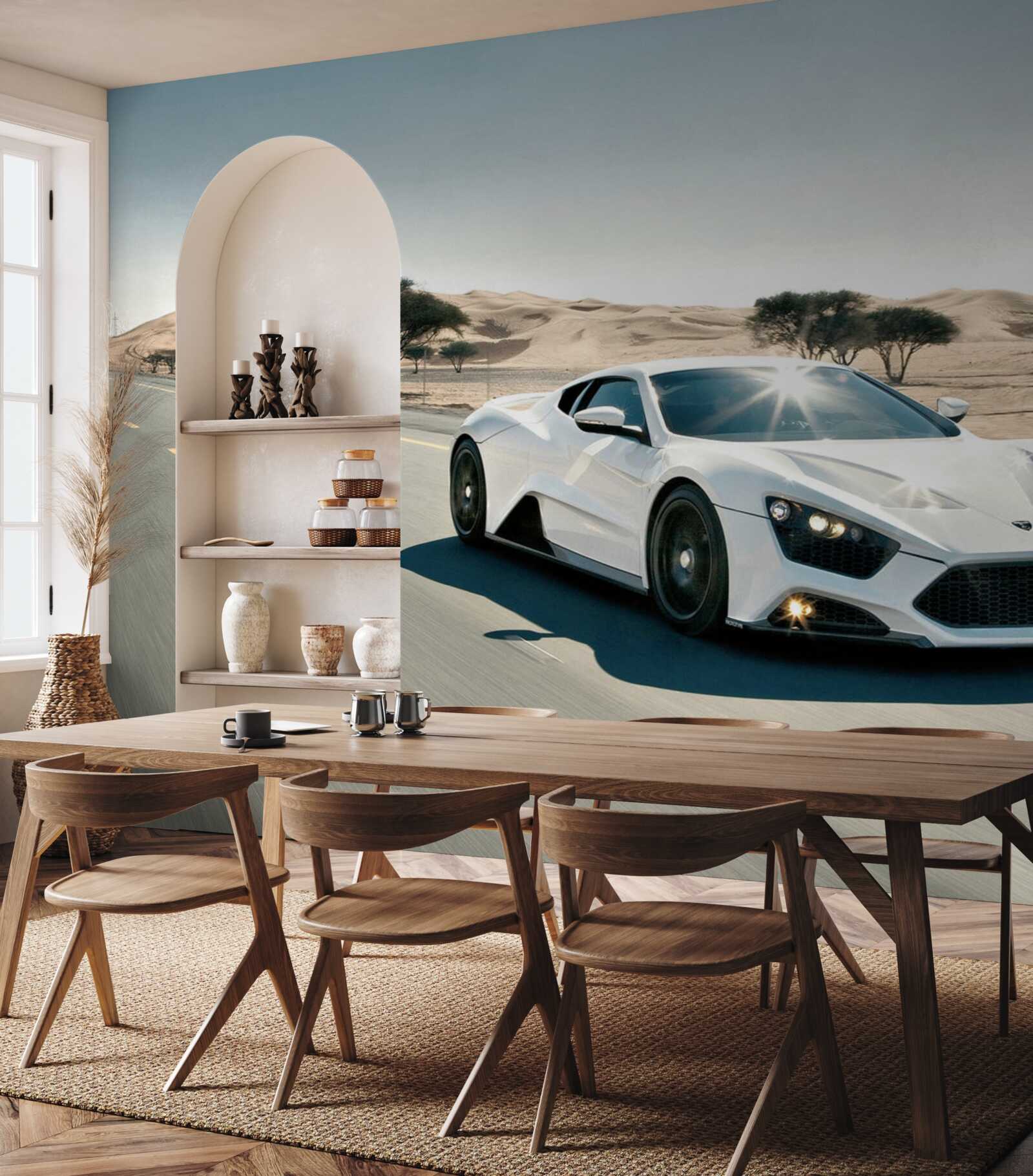 Fotobehang een witte sportwagen rijdt over een lege weg
