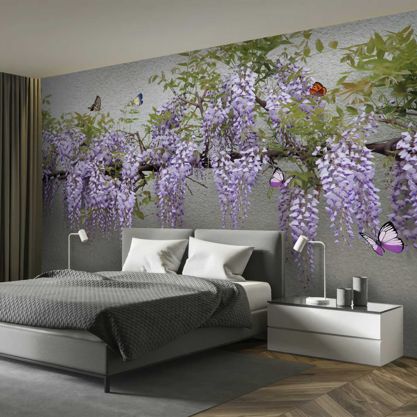 Fotobehang een tak met lila bloesems en fladderende vlinders